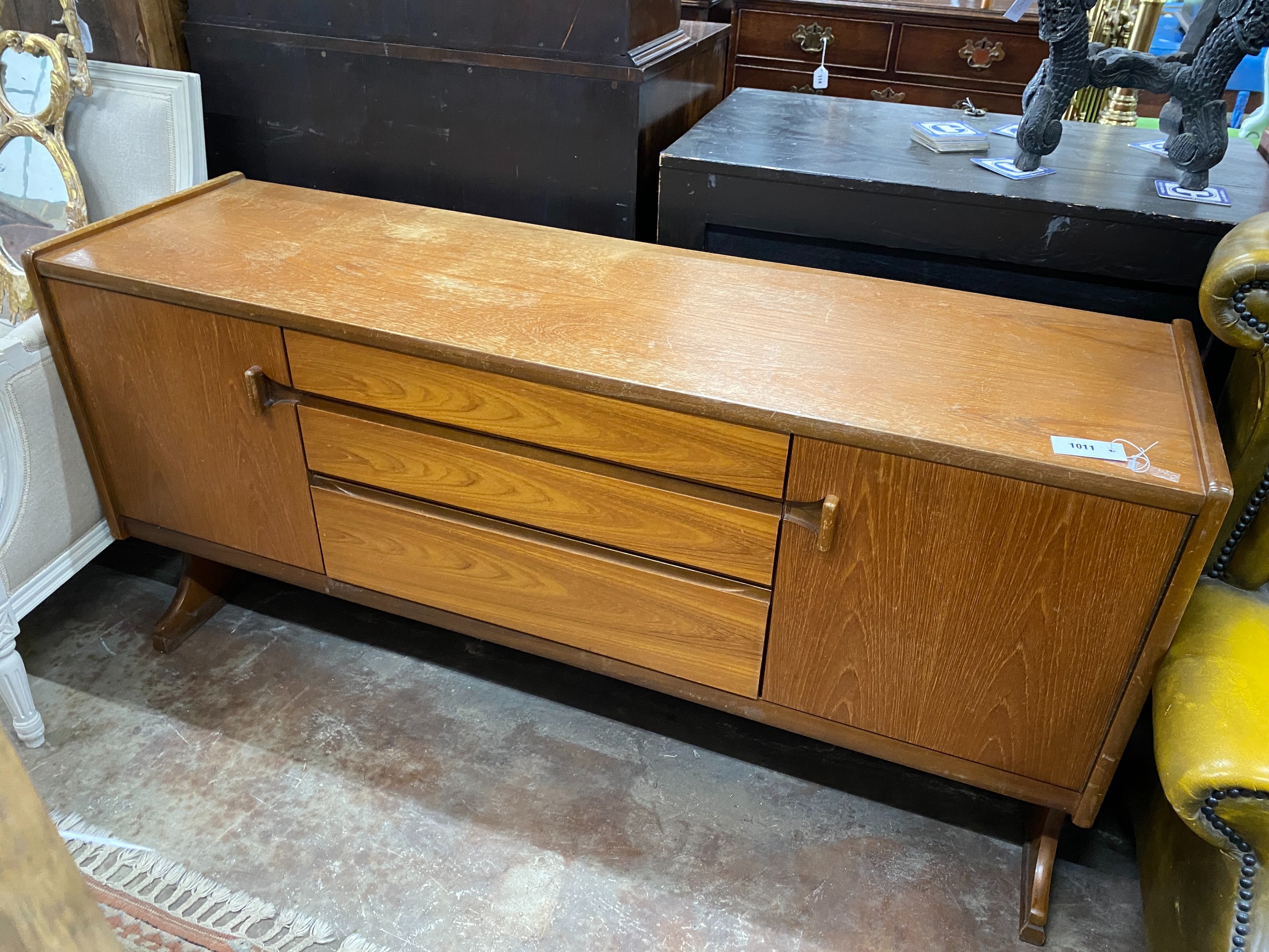 A mid century teak sideboard, length 152cm, depth 44cm, height 77cm